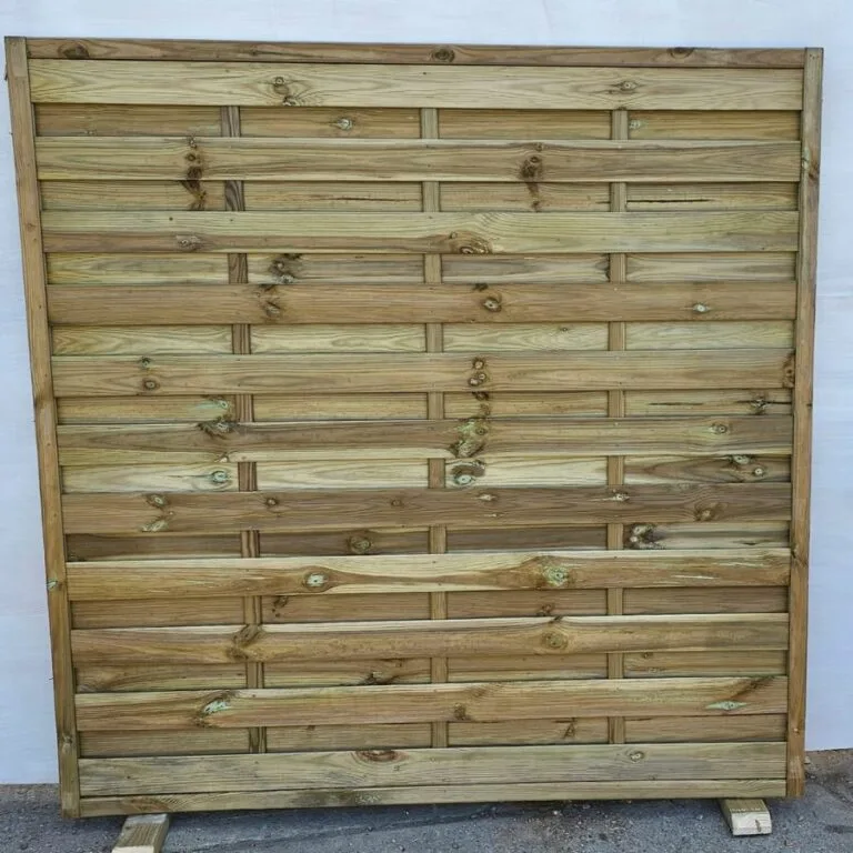 Square horizontal wooden fence panel with a natural finish displayed upright on wooden supports.